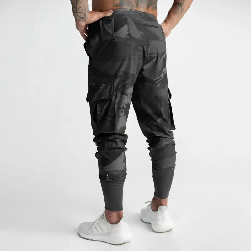 Calças Esportivas Camufladas Masculinas — Leves, Elásticas e de Secagem Rápida para Treinos com Liberdade Total!