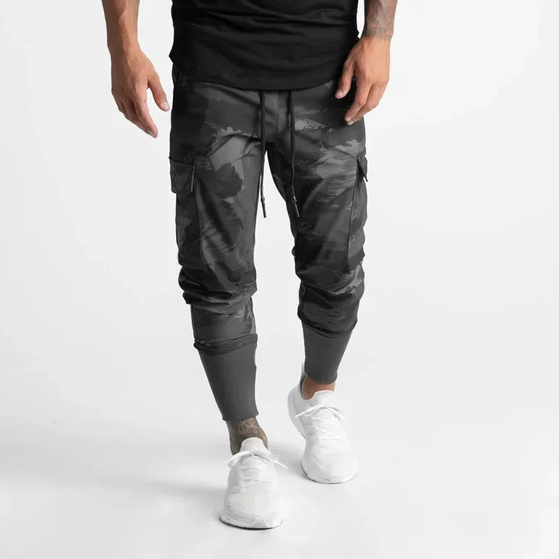 Calças Esportivas Camufladas Masculinas — Leves, Elásticas e de Secagem Rápida para Treinos com Liberdade Total!