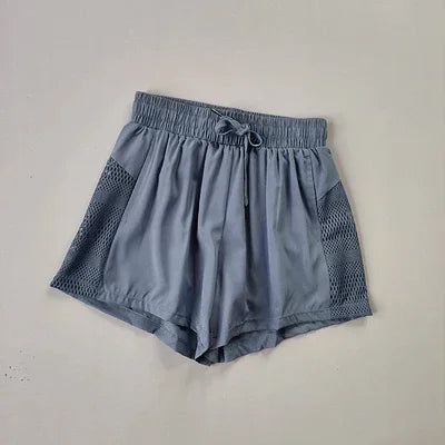 Shorts Fitness 2 em 1 com Cintura Alta — O Segredo das Mulheres que Dominam o Treino com Estilo, Conforto e Liberdade!